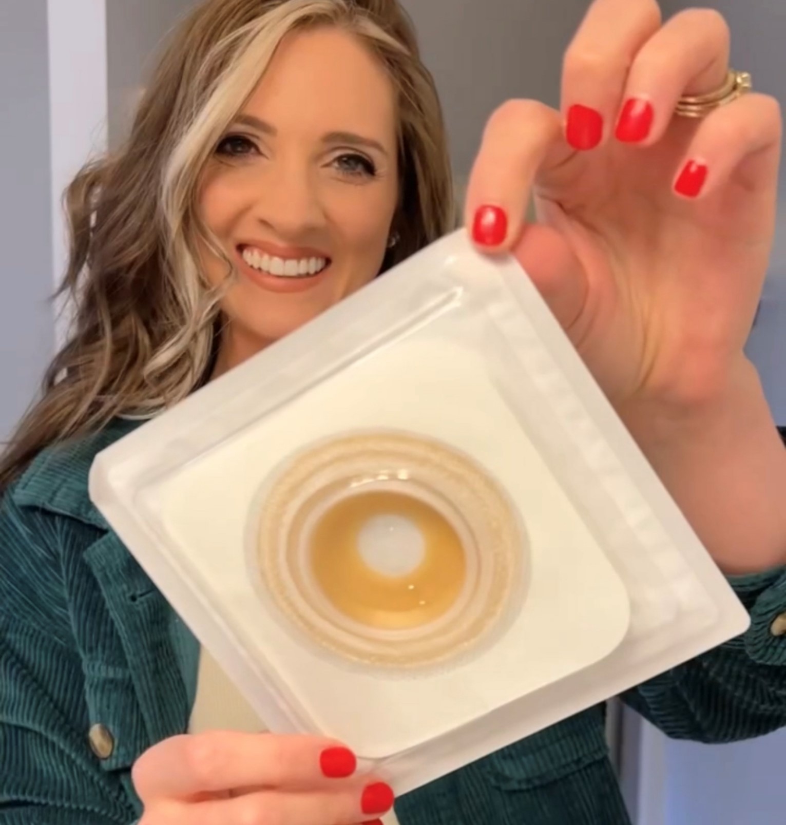 a woman holding a cd