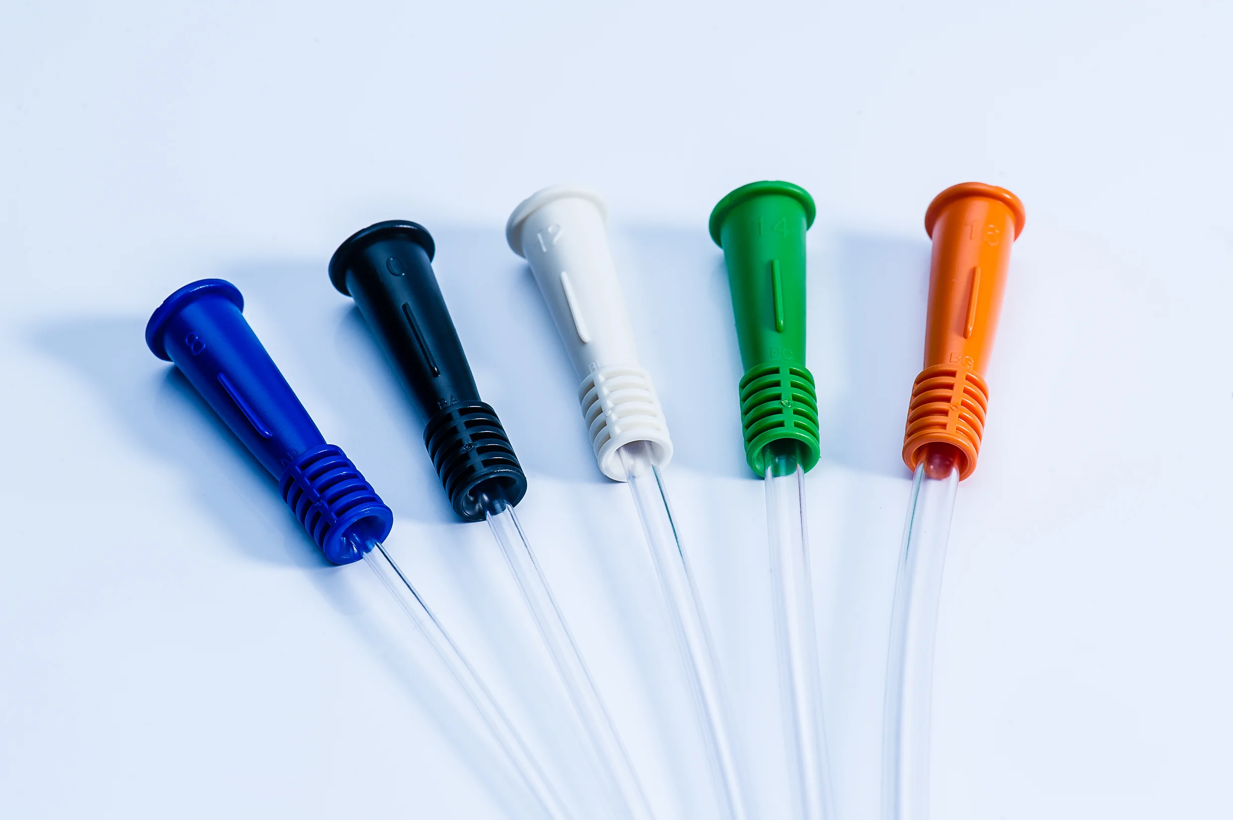 a group of different colored toothbrushes