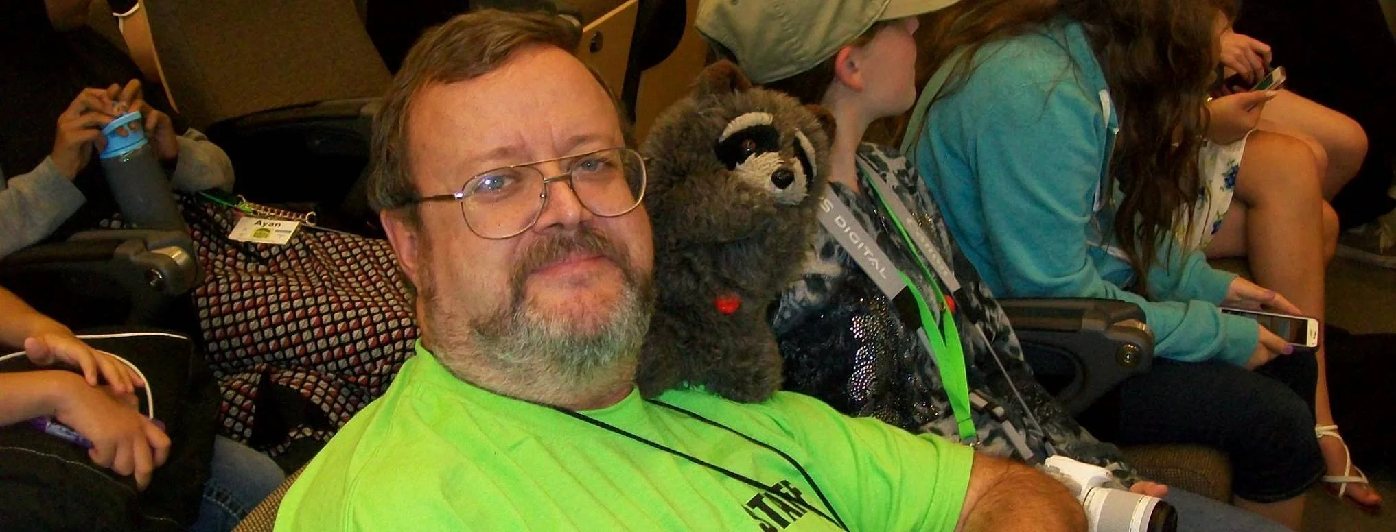 a man with a teddy bear on his lap