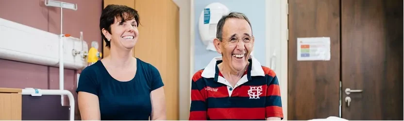 a man and a woman smiling